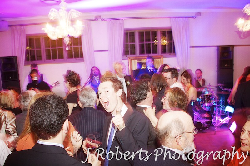 Partying guests on the dance floor - wedding photography sydney